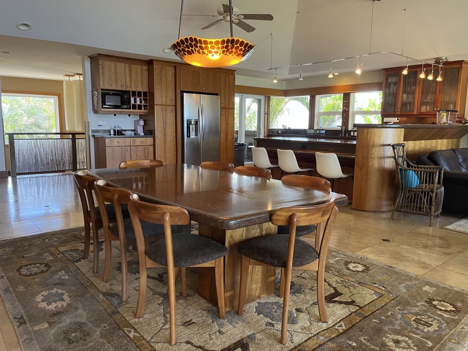 Dining table for 8 plus room for three more at the bar.