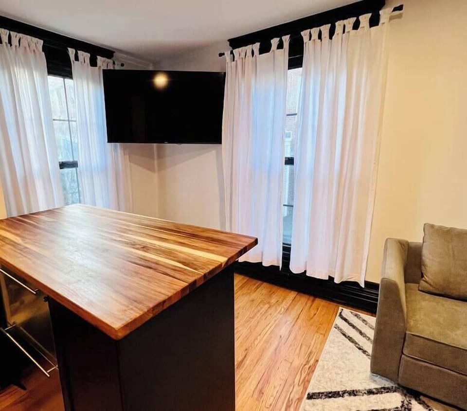 Kitchen bar seating & 55” smart TV