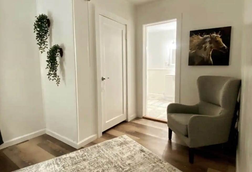 Bedroom one closet and sitting area outside the private full bathroom
