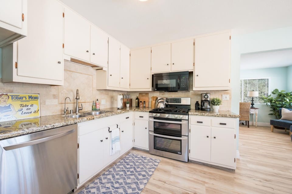 Full kitchen with stainless steel appliances 