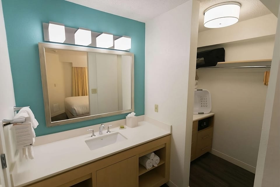 Freshen up easily with bright vanity lighting and open storage.
