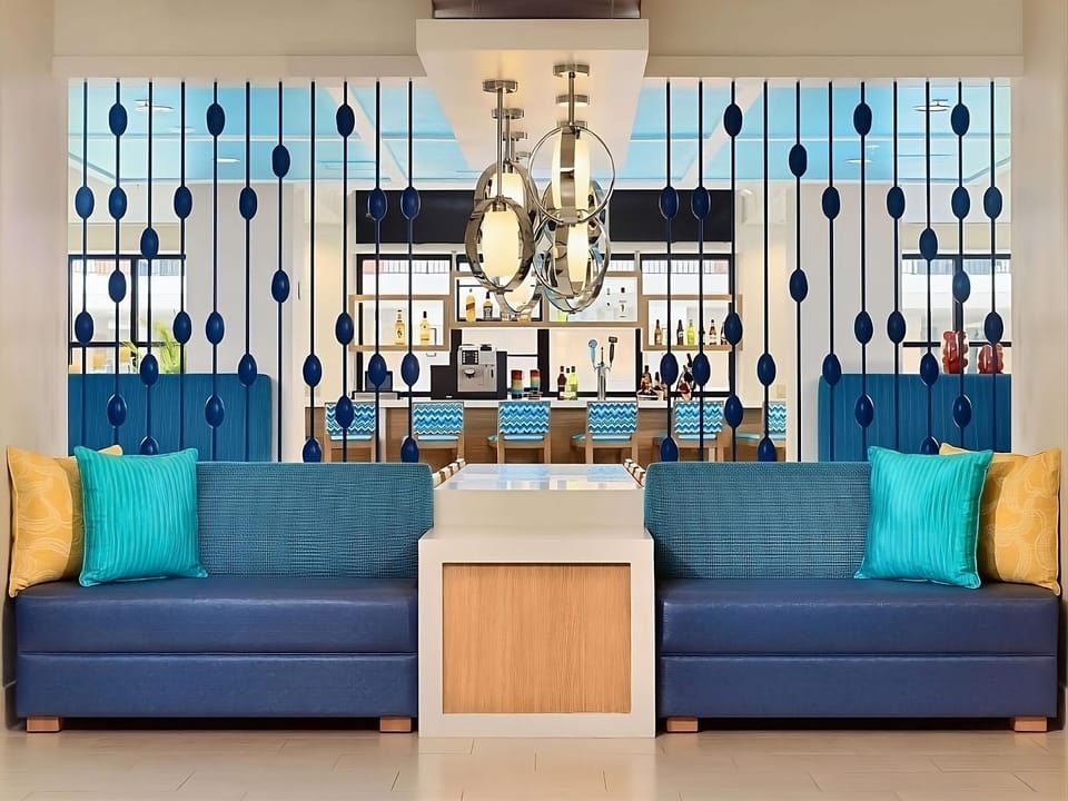 Sink into plush seating with chic lighting and cocktails nearby.