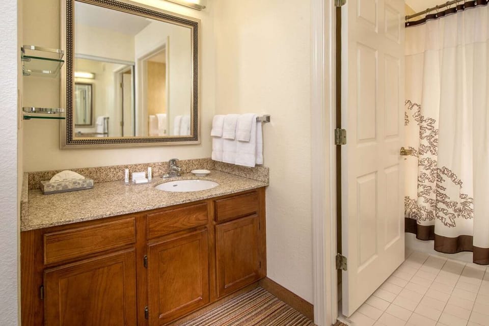 Refresh after adventures with a bright vanity and shower.