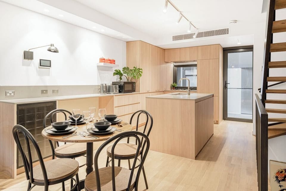 A dining table in the living area allows guests the space to come together for a shared meal.