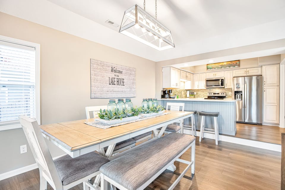 Main dining area offers bar height seating with bench option