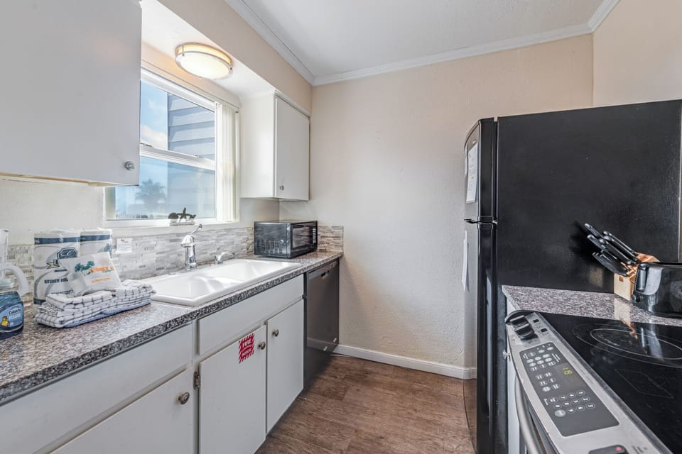 Your fully equipped kitchen awaits with granite countertops, modern appliances, and everything you need to create delicious home-cooked meals during your stay.