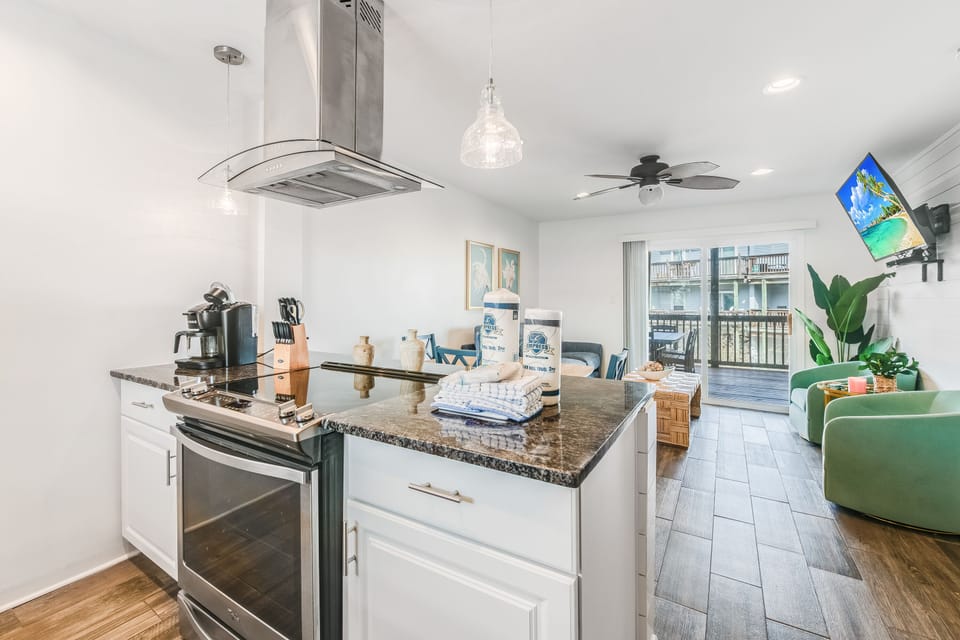 Cook with ease in your fully equipped kitchen featuring granite countertops, stainless steel appliances, and modern conveniences that make meal prep a joy.