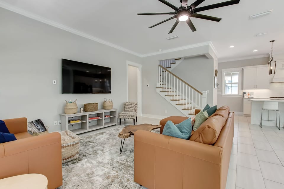 Kitchen located behind, as well as hallway for primary bedroom and stairwell. 