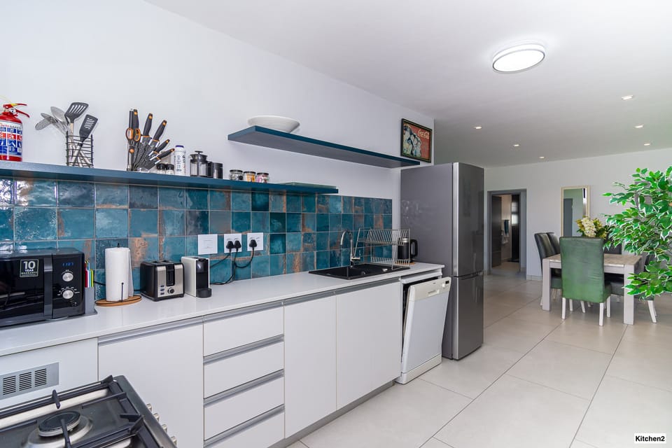 Beautiful kitchen with dishwasher and full fridge