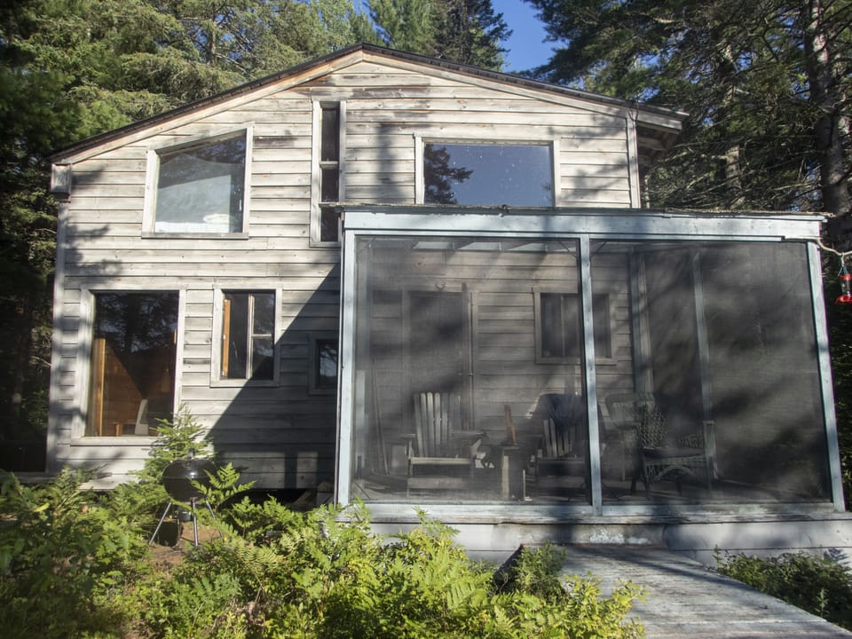 north facing cabin front onto pond