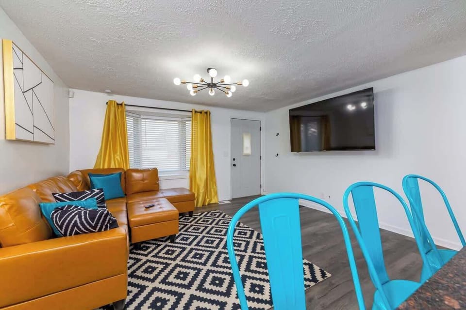 Cute and cozy living with a 70" Roku Smart Tv. 

Huge island separating the Kitchen from the living room.