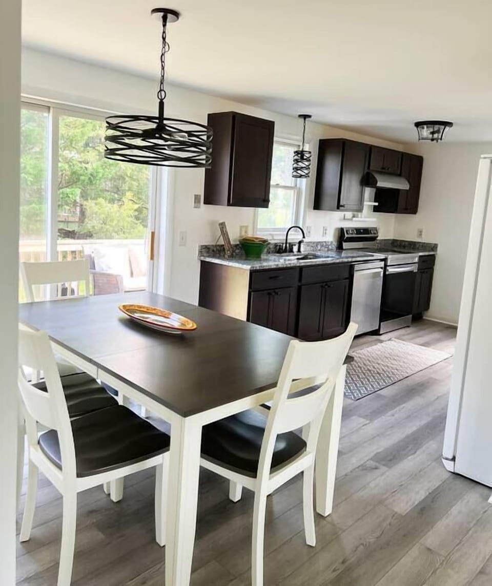 Brand new well stocked kitchen and dining area with sliding doors to deck area.