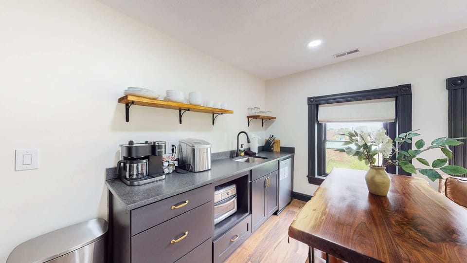 Living Room: The kitchenette comes with a mini fridge, microwave, sink, and some basic kitchen supplies.