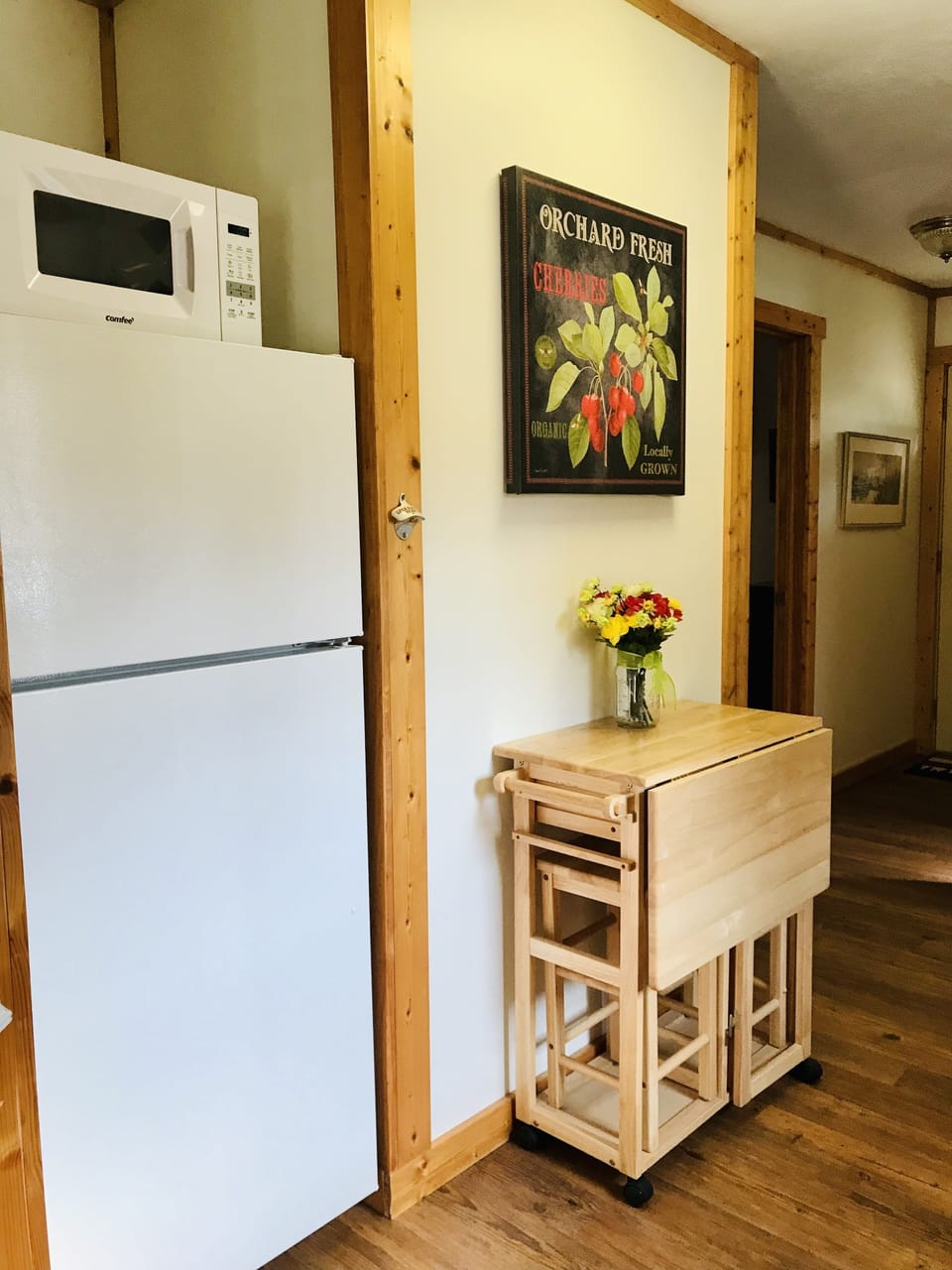 Full size fridge, microwave, and island for extra counter space and seating.