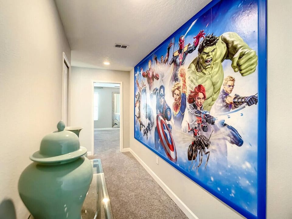 Step into the adventure zone! Our hallway features an epic Avengers frame to kick off your stay with superhero vibes.
