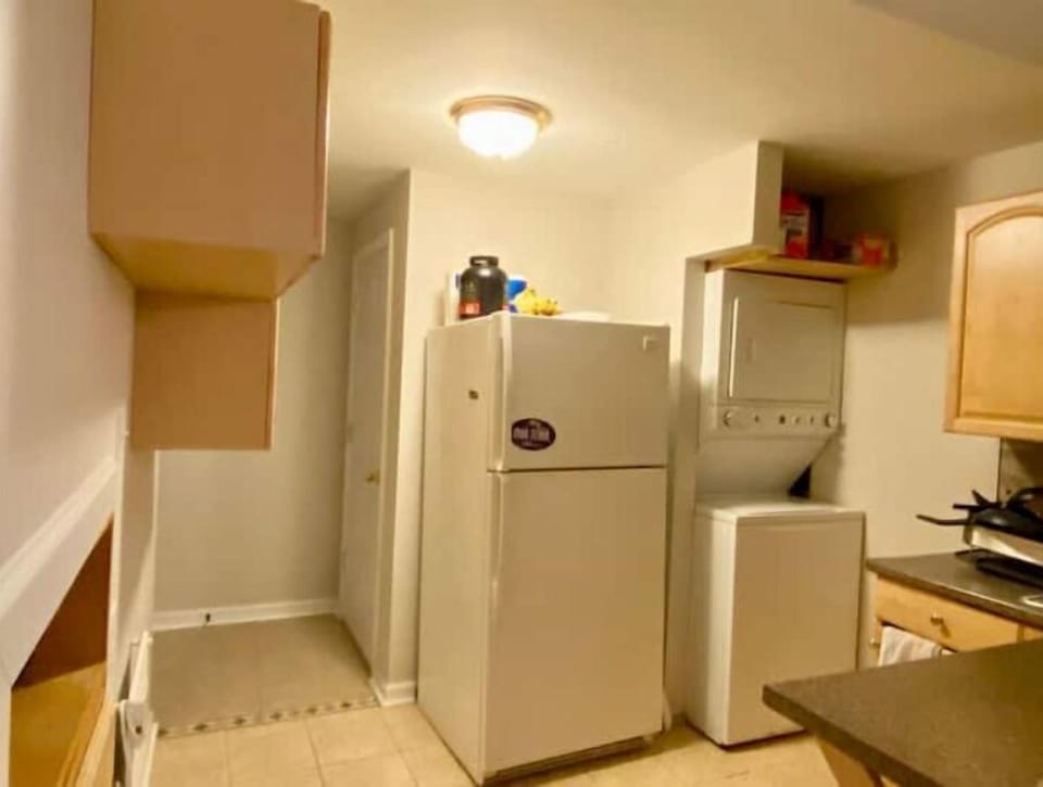 Kitchen with washer and dryer for guests