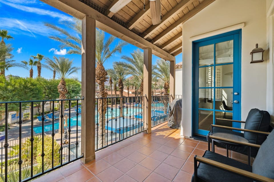 View of main pool and clubhouse areas from the balcony.