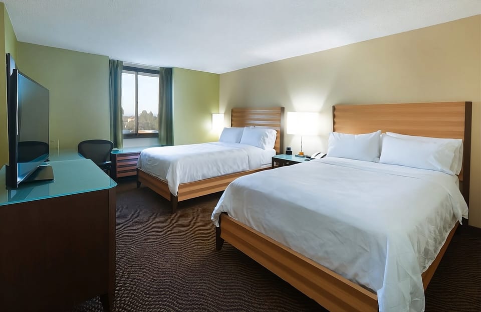 Stretch out on two plush beds after a busy day.