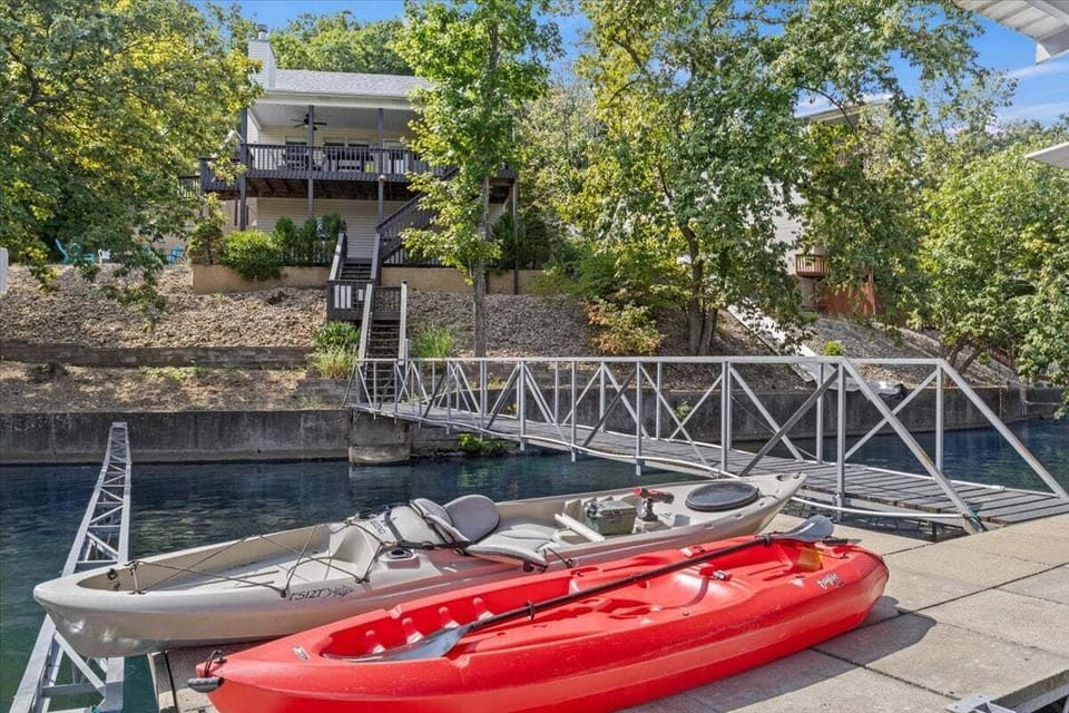 Relax lakeside on one of two deck areas, or on the private dock. Enjoy a day full of fun on the lake with kayaks, swim dock with covered seating, diving board and wet steps!