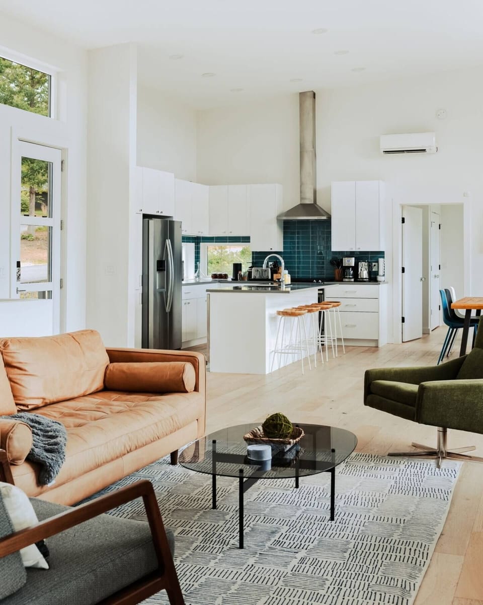 The heart of the home, this open-concept space blends the kitchen, dining, and living areas for effortless connection, whether you’re cooking, relaxing, or entertaining.