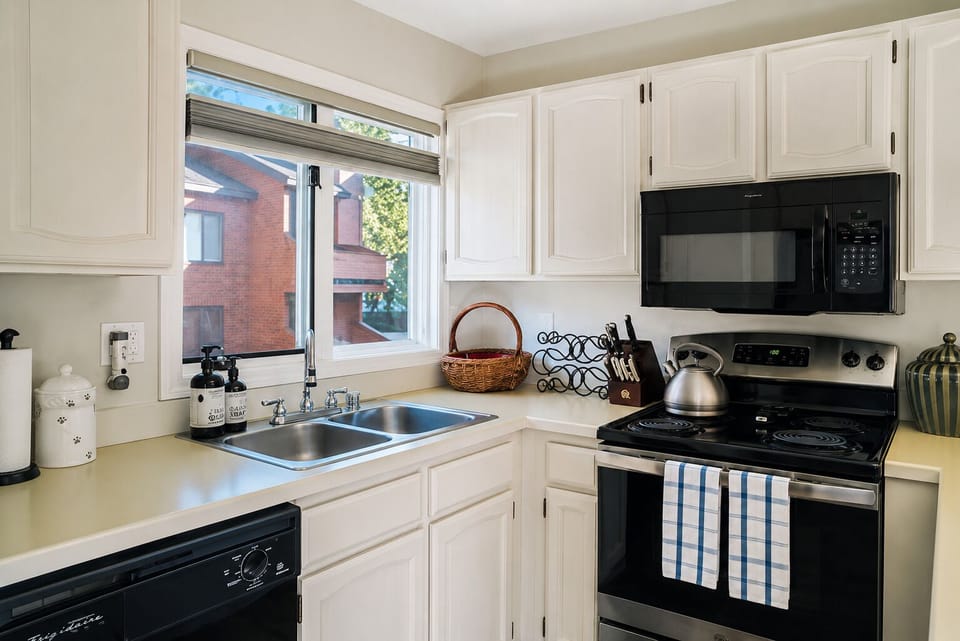 Well stocked kitchen with updated appliances and the conveniences of home