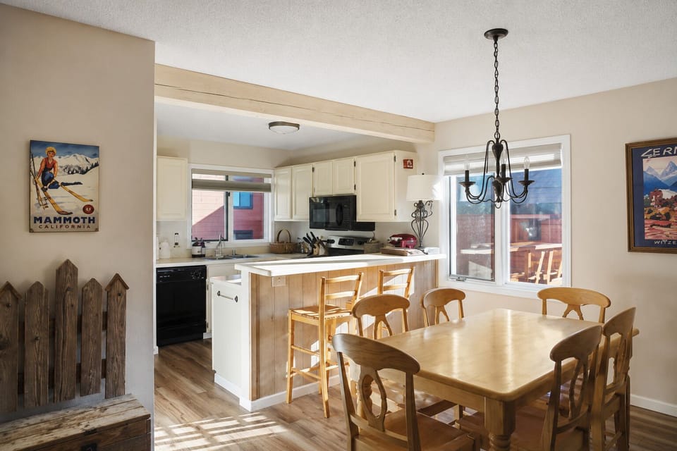 Open concept dining and kitchen area, with seating for eight and a breakfast bar