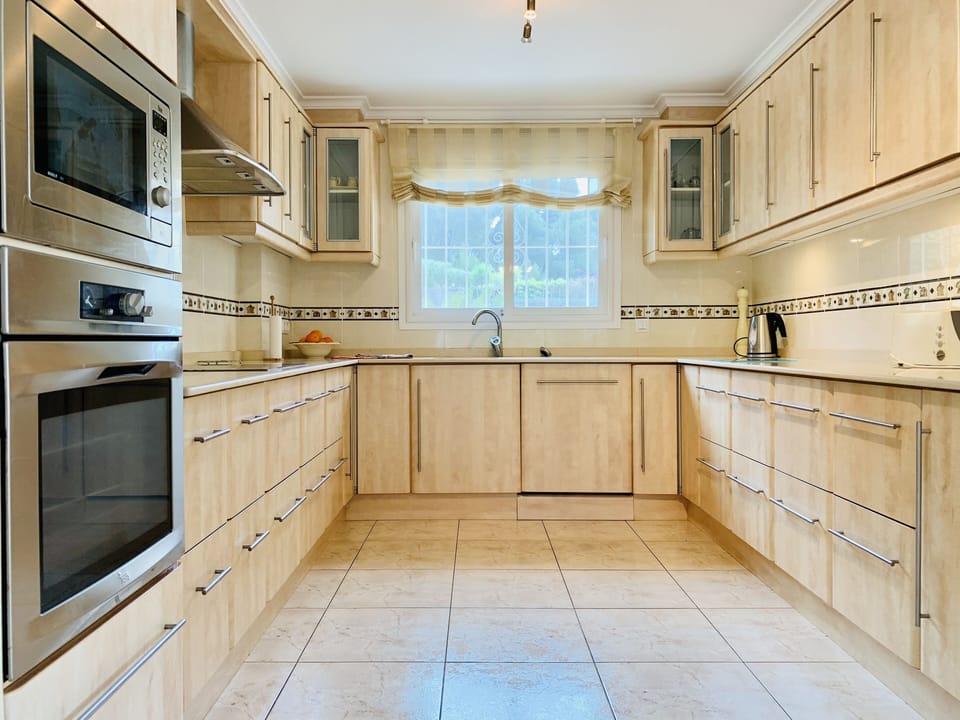 Well equipped kitchen.  A door to the right leads directly onto the rear terrace