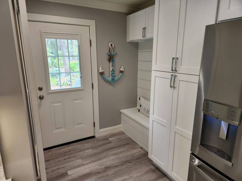 Side entry door & bench by kitchen.