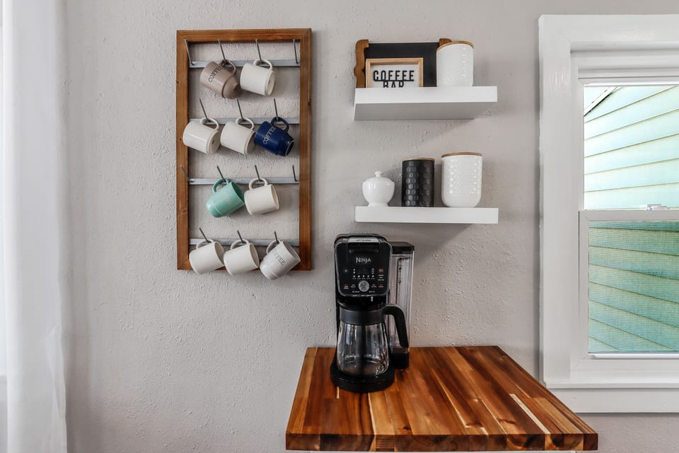 Coffee bar with pods, creamer, sugar.