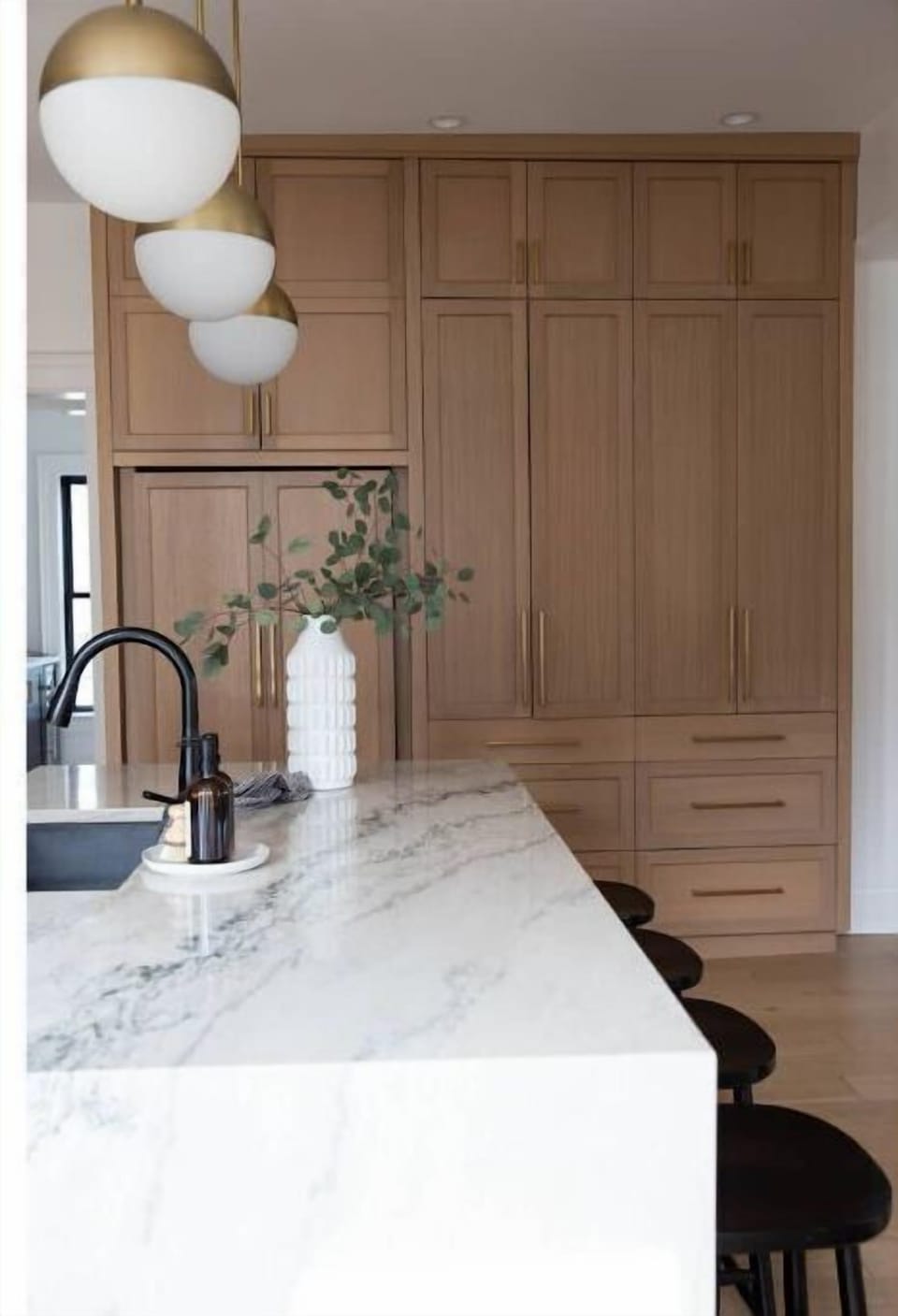 Floor to ceiling custom cabinetry and a built in refrigerator.  