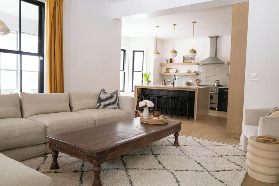 We brand new Montauk sectional and a blend of vintage and modern furniture.