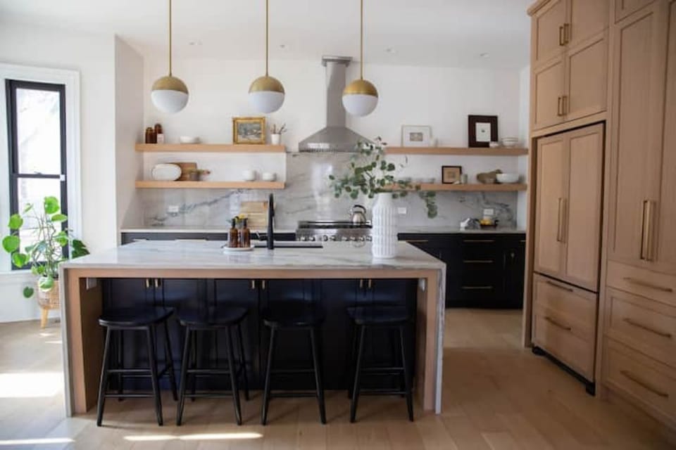 Custom chef's kitchen with a 6 burner gas range, full spice drawer.