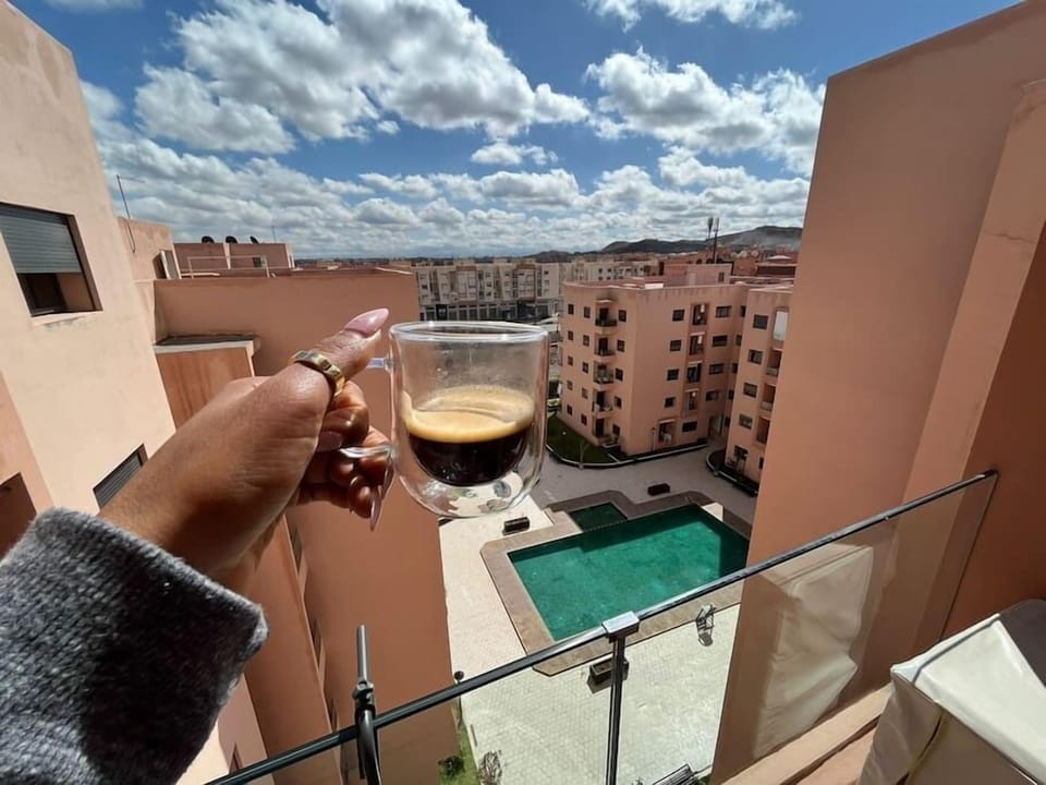 Enjoy a freshly made cup of coffee with view on the pool.