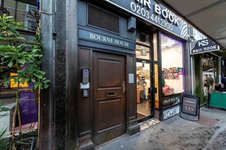The building entrance is secured with double doors requiring an entry code.