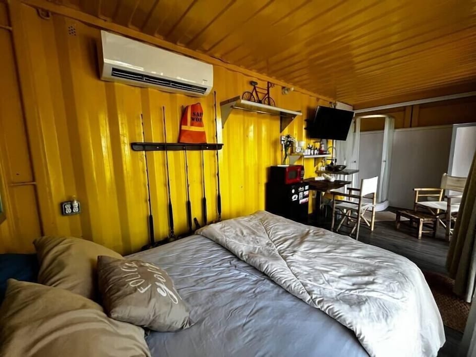 Full size bed, commodities such as microwave, small fridge, coffee pot and accessories.