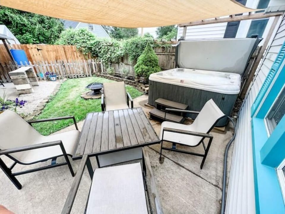 Backyard with private hot tub, fire ring and grill