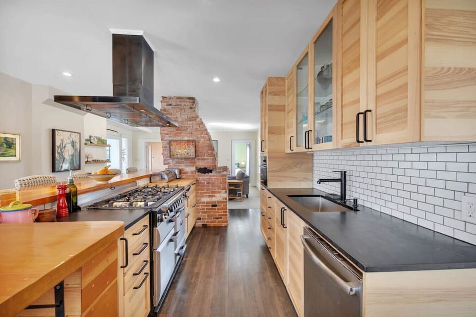 Brand new updated & modern kitchen. Slate and butcher block countertops and bar seating for 8. Fully equipped for all of your cooking needs, including a AGA propane stove, zavor quick pot and kitchen aid stand mixer.