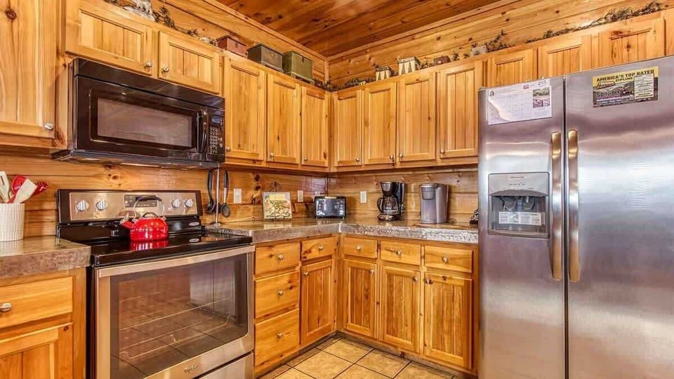 Whip up culinary delights in this spacious, well-equipped kitchen with warm wood accents!