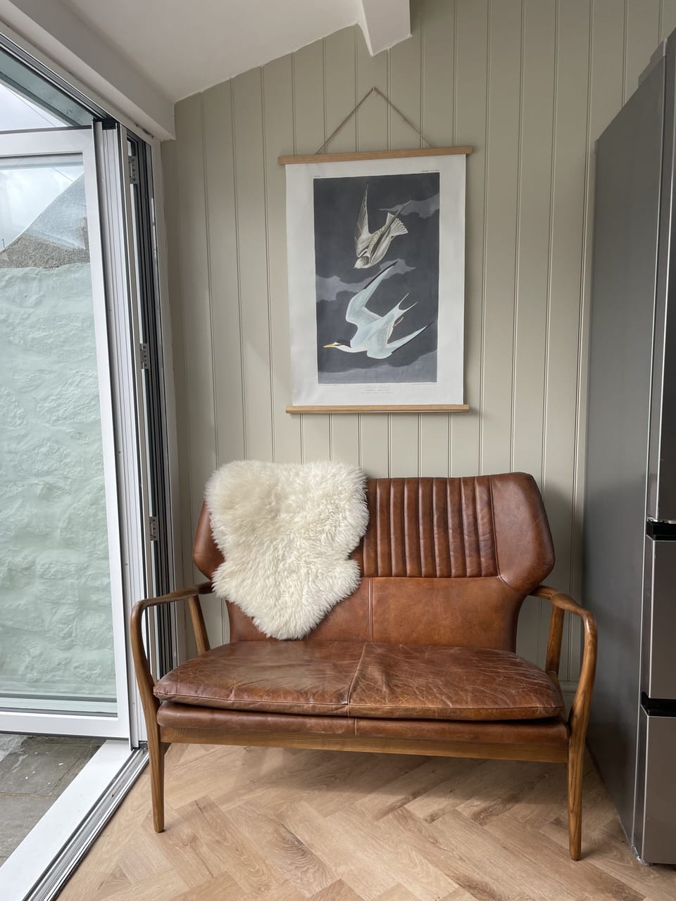 Comfortable sofa in sunny spot in kitchen
