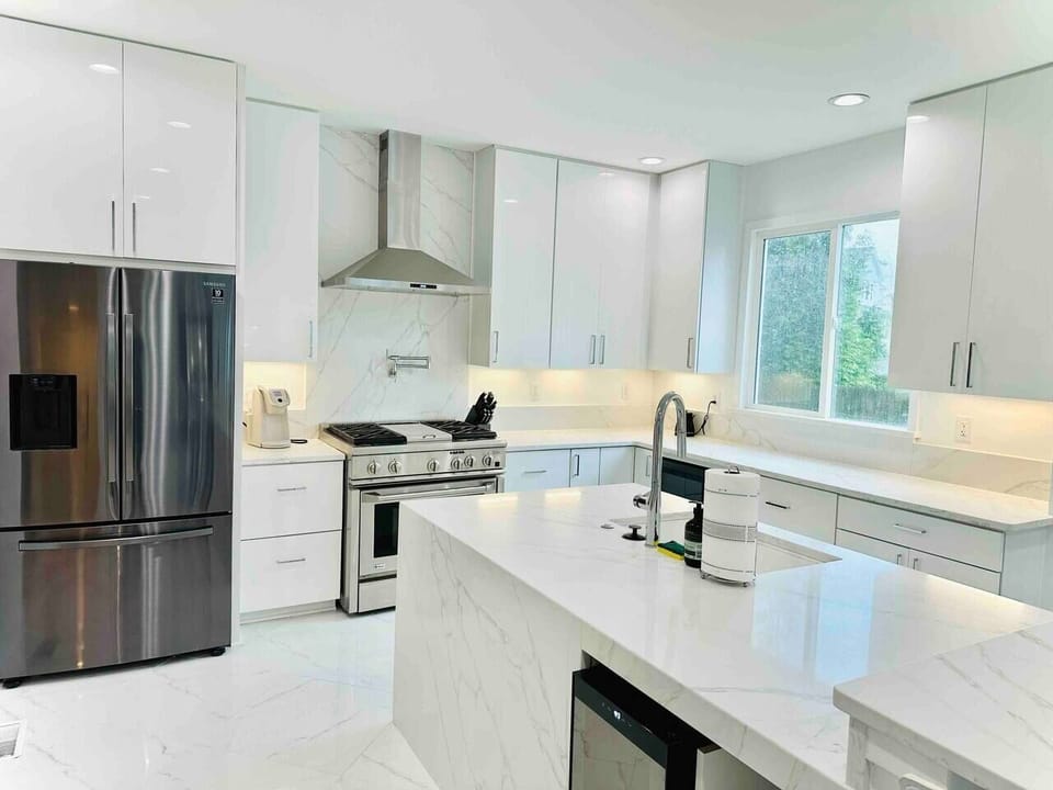 Chef's kitchen comes complete with everything you need for cooking a delicious meal. Stainless steel appliances, gas range, ice maker, and wine fridge.