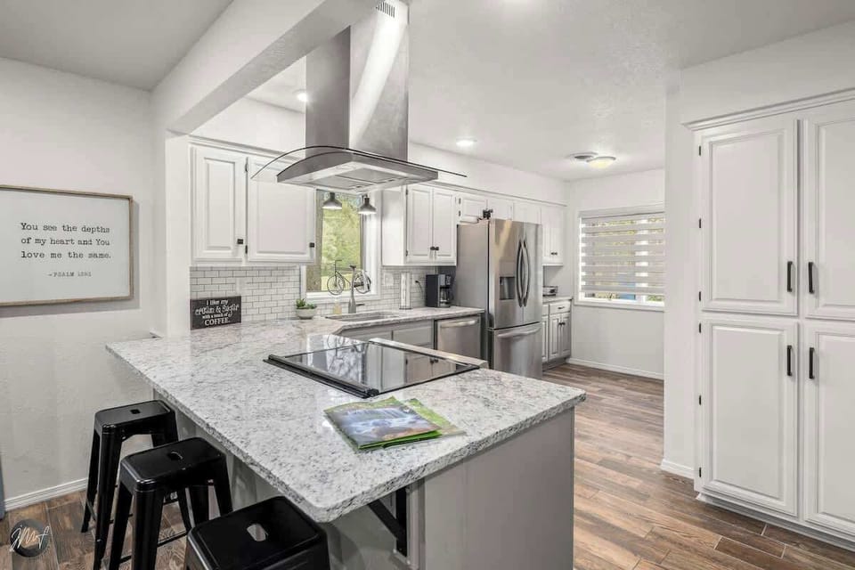 Transform your cooking space into a serene sanctuary with stunning white cabinets!
