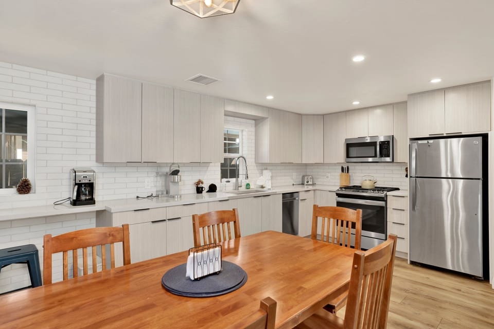 Fully equipped cabin kitchen with ample cabinetry, stove, fridge, microwave, and coffee maker—perfect for cooking meals, morning coffee, and feeling right at home on your stay.