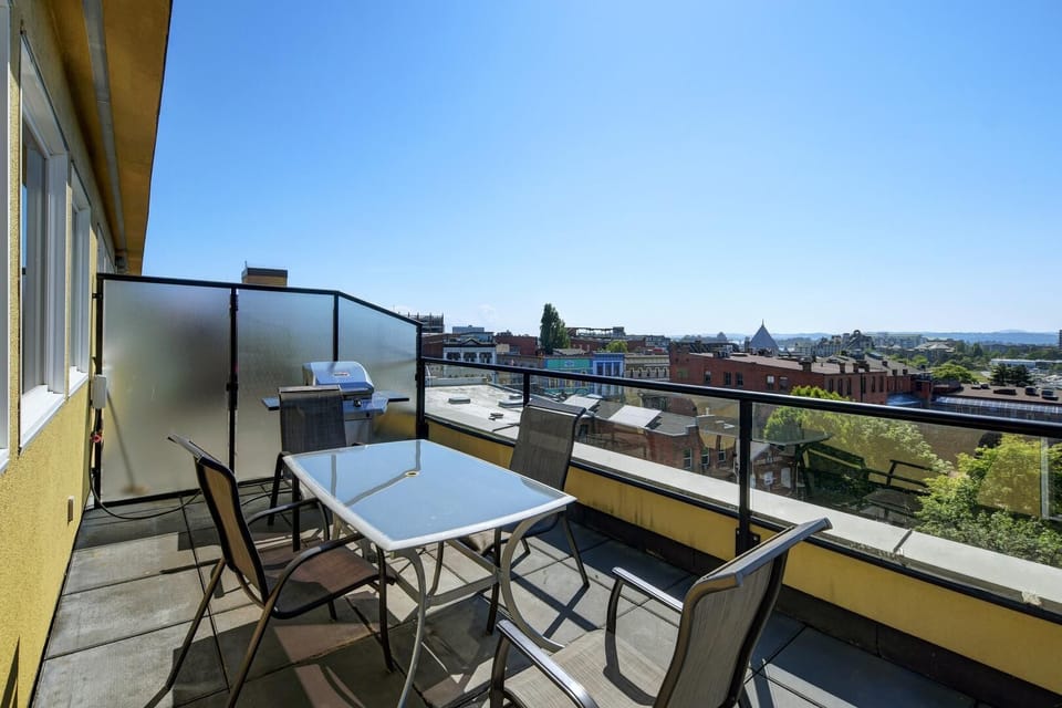 Fire up the grill! Step onto your private patio with outdoor furniture and a BBQ, perfect for dining under the blue skies.