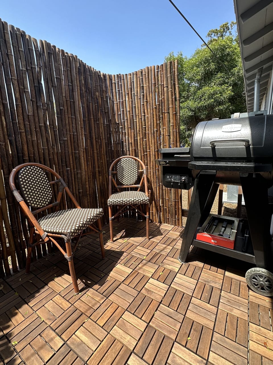 Patio seating with the bbq grill perfect for sunny summer cookouts. 