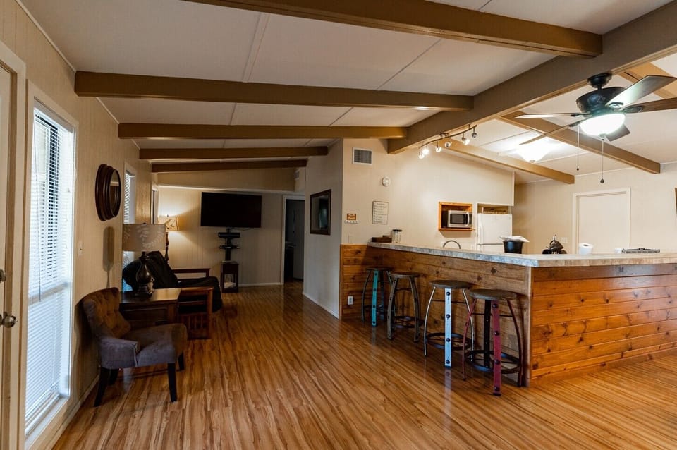 Living room view of bar and kitchen