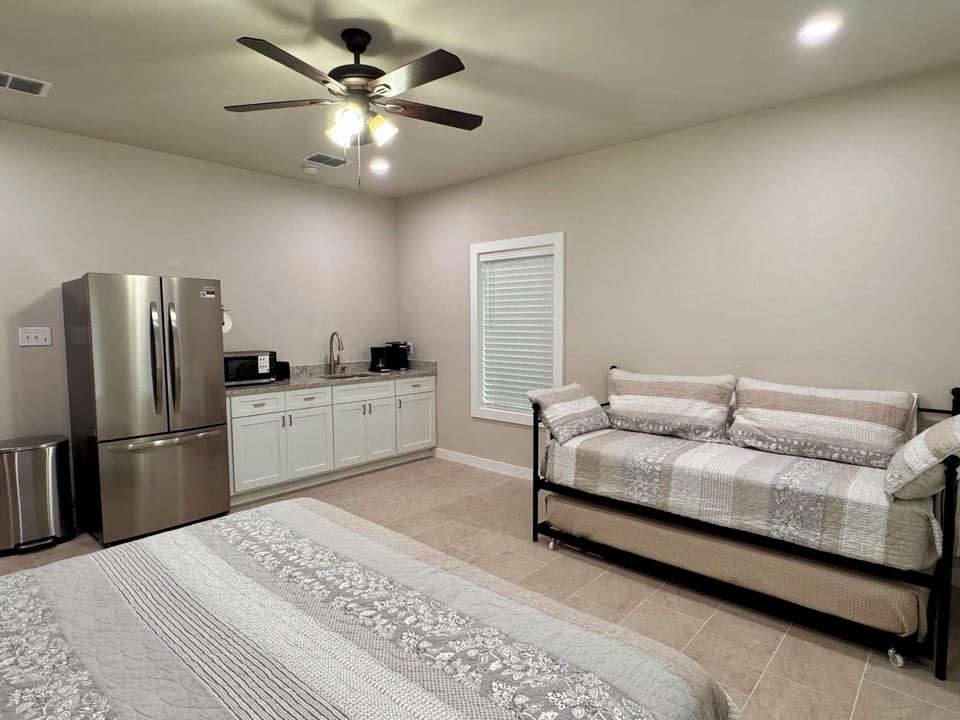 Your comfortable studio combines sleeping and living in one bright, modern space. Relax on the cozy daybed or prepare snacks with the full-size fridge and kitchenette at your fingertips.