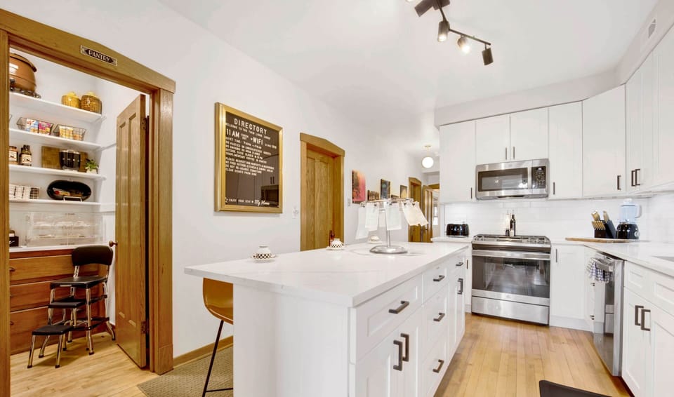 Walk-in pantry located off the kitchen allowing for convenient access.