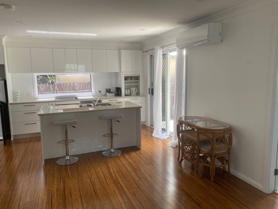Light and airy kitchen with a 1 way mirrored window for privacy.