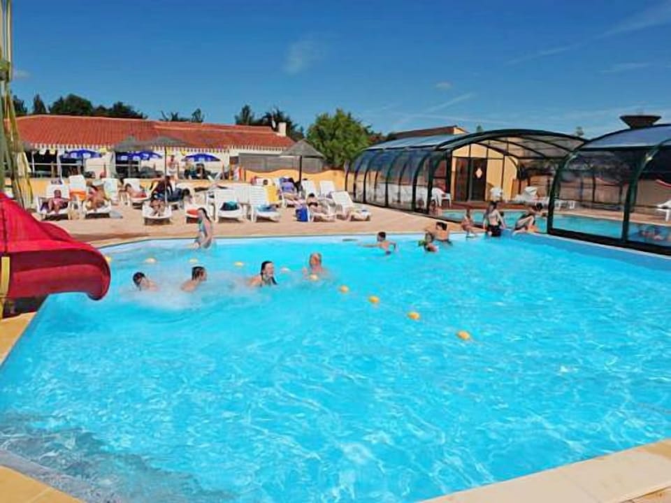 Spacious outdoor pool area, perfect for a refreshing dip and enjoying sunny days with family and friends.