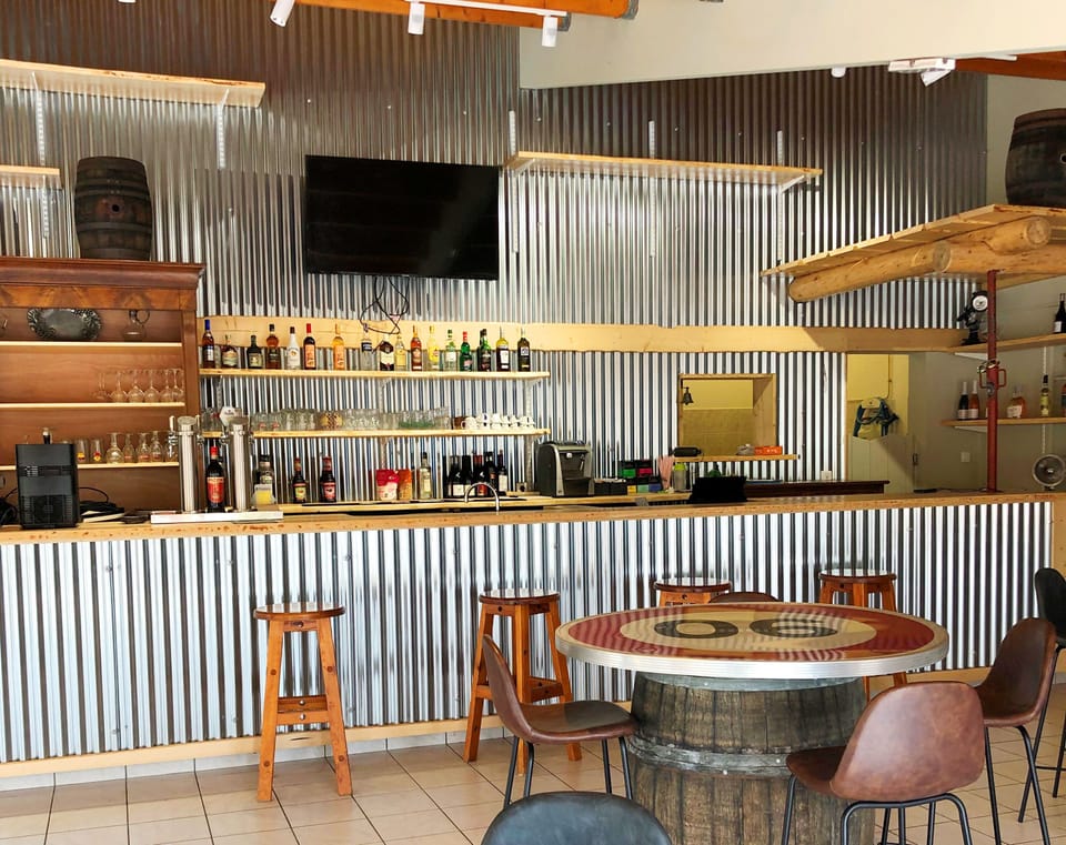 Cozy and stylish bar area, inviting guests to relax and enjoy refreshing drinks in a welcoming ambiance.